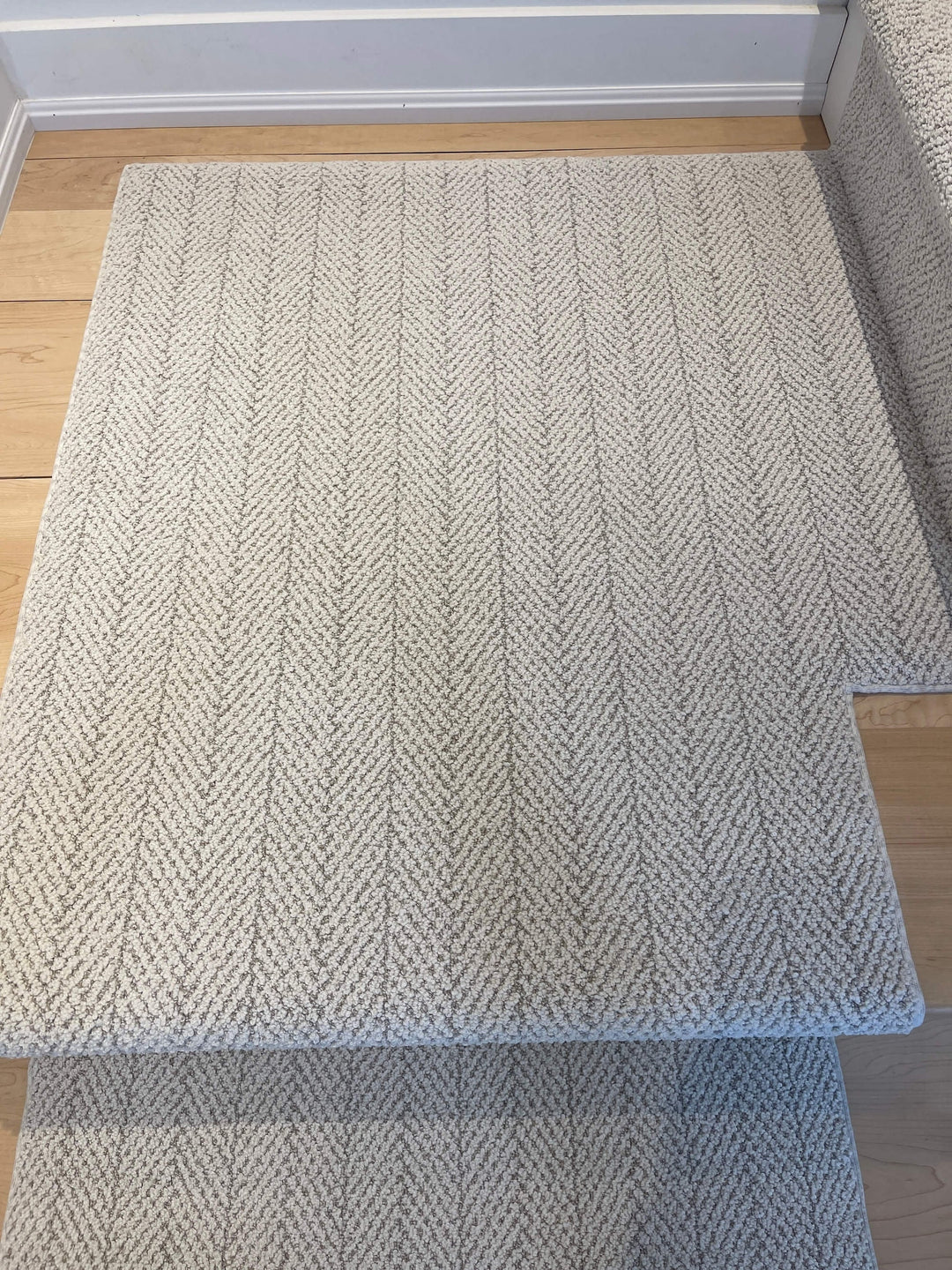Amalfi Carrara Herringbone Stair Runner Landing Canada installed on a stair landing