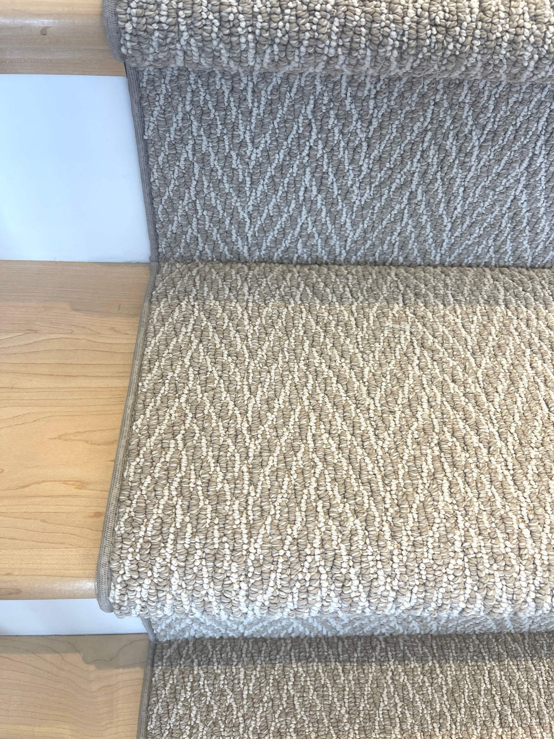 Rolled view of Anderson Tuftex Basket Herringbone Stair Runner Canada showing bound edges