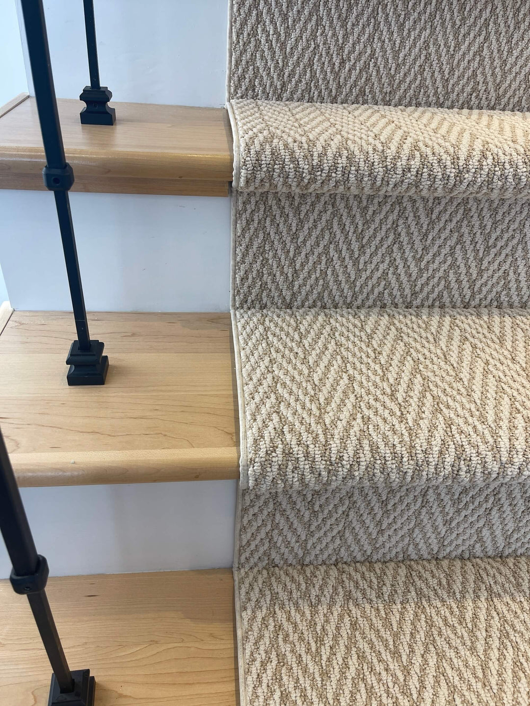 Full staircase view of Anderson Tuftex Boutique Herringbone Stair Runner Canada in elegant beige tones