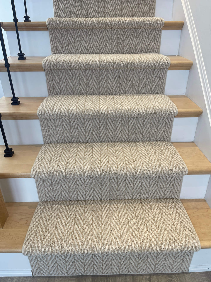 Side angle view of Anderson Tuftex Boutique Herringbone Stair Runner Canada installed on wood stairs