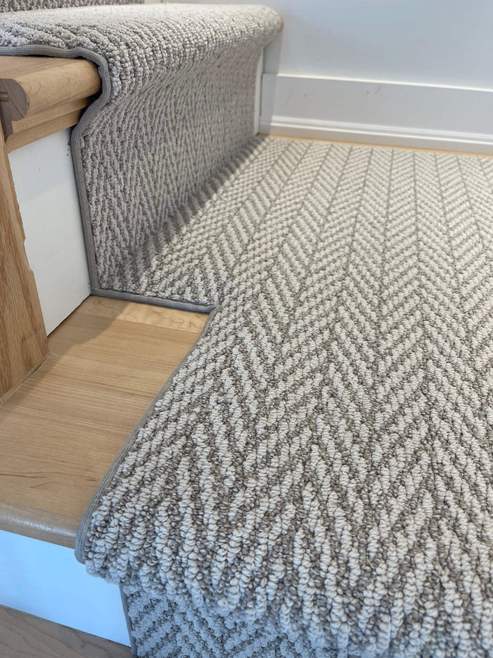 Side angle of Anderson Tuftex Fossil Herringbone Stair Runner Canada installed on stairs
