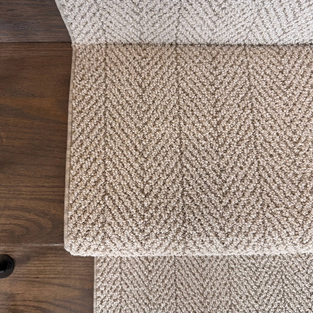 Close-up of Amalfi Capri beige herringbone carpet texture