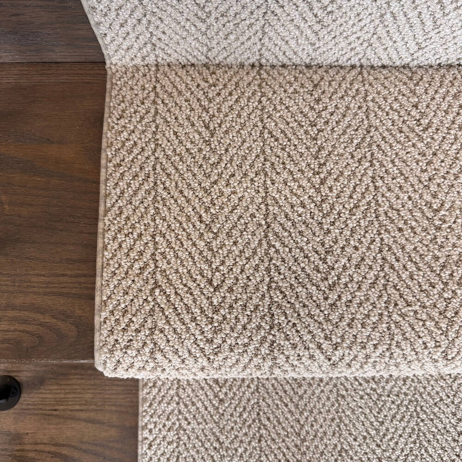 Close-up of Amalfi Capri beige herringbone carpet texture