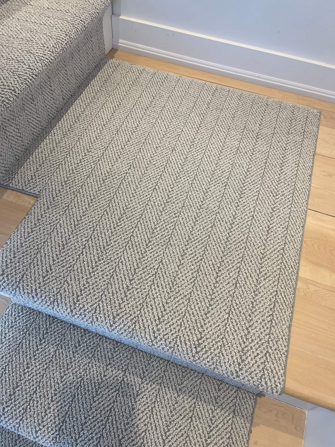 Full view of Amalfi Santa Marina Herringbone Stair Runner Landing Canada in gray tones