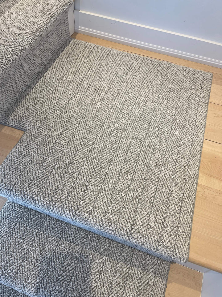 Full view of Amalfi Santa Marina Herringbone Stair Runner Landing Canada in gray tones